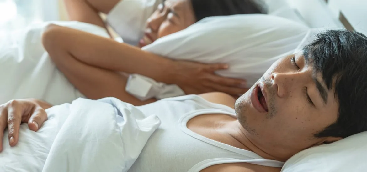 man suffering from sleep apnea